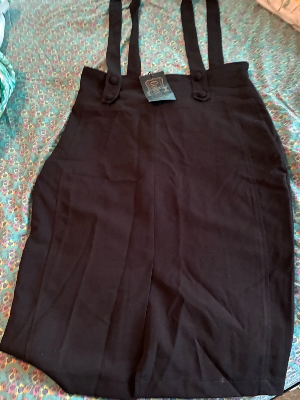 Black ( suspender look) with black straps and a pencil-like dress.
